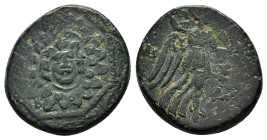 PONTOS.Amisos.(Circa 105-63 BC).Ae.

Obv : Aegis with Gorgon's head at center.

Rev : AΜΙΣΟΥ.
Nike advancing right, holding wreath and palm branch, be...