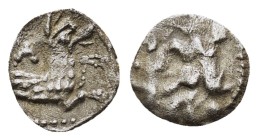 LYCAONIA.Laranda.(Circa 324-323 BC).Obol.
Obv : Baaltars seated left, holding grain ear, bunch of grapes, and scepter.
Rev : Forepart of wolf right;...