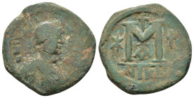 Justin I. 518-527. Æ Follis Constantinople mint. Struck 518-527. 

Diademed, draped and cuirassed bust right / Large M 
between two stars; cross above...