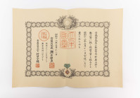 Japan, Verleihungsurkunde zum Orden des heiligen Schatzes 3. Klasse, mittig gefaltet, leichte Gebrauchsspuren, Zustand 2.