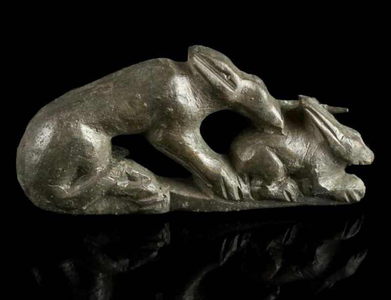 A Roman Bronze Hare and Hound Brooch
Circa 2nd-3rd century AD.
Well modelled ope...