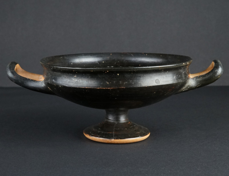 An Attic Black Glazed Stemmed Kylix
Circa 5th century BC.
Greek terracotta cup w...