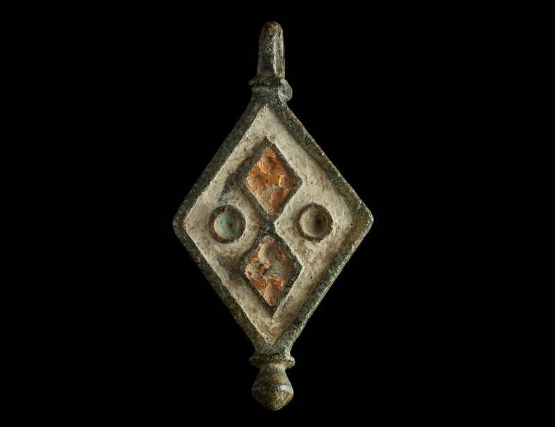 A Roman Bronze Lozenge-Shaped Enamelled Pendant
Circa 2nd century AD.
Lozenge-sh...