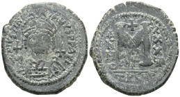 Byzantine Coins JUSTINIAN I.(527-565). Antioch.Follis. Obv: D N IVSTINIANVS P P AVG. Helmeted and cuirassed bust facing, holding globus cruciger and s...