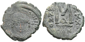 Byzantine Justinian I Æ 40 Nummi. Catania(?), dated RY 30 = AD 556/7. D N IVSTINIANVS PP AVC, helmeted and cuirassed bust facing, holding globus cruci...