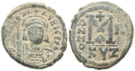Byzantine Maurice Tiberius, 582-602. Follis , Cyzicus, RY 10 = AD 591/2. O N mA૪RC TibЄRI P P [AVG] Helmeted and cuirassed bust of Maurice Tiberius fa...