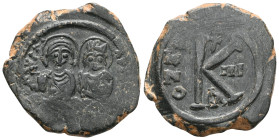 Byzantine Justin II, with Sophia, Æ 20 Nummi. Constantinople, dated RY 6 = AD 570/1. D N IVSTI[NVS P P AVG], Justin on left, Sophia on right, seated f...