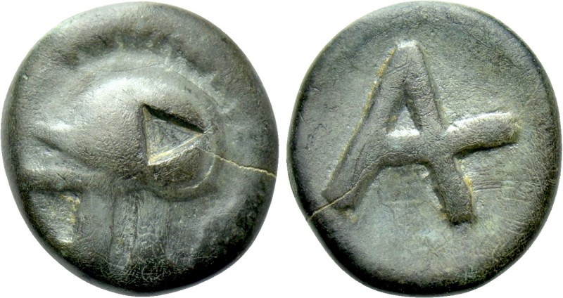 TROAS. Achilleion. Ae (4th century BC). 

Obv: Helmet left.
Rev: City monogra...