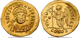 Justin I (AD 518-527). AV solidus (20mm, 4.46 gm, 6h). NGC AU 5/5 - 2/5, edge bend, clipped, grafitto. Constantinople, 2nd officina, AD 518-519. D N I...