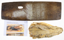 Ethnographics - Kiriwina Island (Papua New Guinea) - bundle of processed banana leaves, used as money in the 'sagali' mortuary ceremony, with the boar...