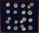 Ancient coins in lots - Byzantine coinage - A wooden cassette with Byzantine Folles, several rulers and mints - in total c. 21 bronzes, in several gra...