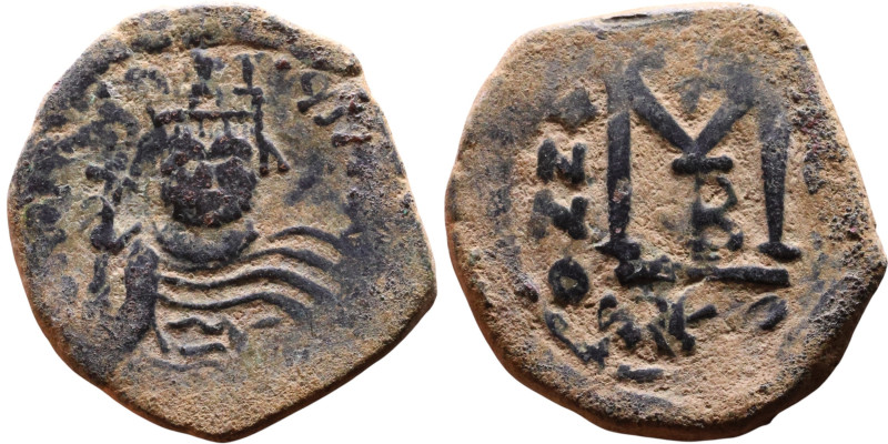 Heraclius (610-641) Follis. Obverse: Helmeted and cuirassed bust facing, holding...