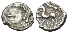 Central Gaul. Bituriges Cubi, c. 70-50 BC. AR Quinarius (13mm, 1.91g, 9h). Celticized male head with thick locks to l. R/ Celticized horse prancing to...