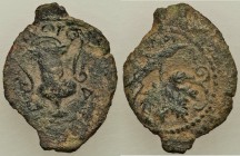 JUDAEA. Roman Procurators. Valerius Gratus (AD 15-25). AE (16mm, 1.58 gm, 6h). VF, bent. Jerusalem, dated Year 4 (AD 17/18). KAICAP, cantharus with sc...