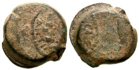 Judaea, Hasmonean Kingdom. Mattathias Antigonos. 40-37 B.C.E. AE 8 prutot (24.4 mm, 14.19 g, 12 h). Crossed cornucopias / Ivy wreath tied with ribbons...