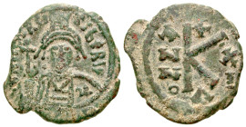 Maurice Tiberius. A.D. 582-602. AE half follis (22.6 mm, 4.85 g, 6 h). Constantinople mint, dated year 11 = A.D. 592/593. D N MAVR TIBER PP AV, helmet...