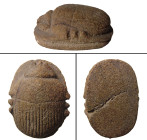 A large Egyptian stone heart scarab, Late Period, 664 - 332 B.C. , well-carved in a brown porphyry, with striated wing cases and detailed head and leg...