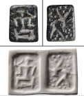 A serpentine double-sided stamp seal, Northern Syria, ca. 2nd Millenium BC. , rectangular in shape and drilled lengthwise, one side depicting a kneeli...