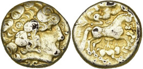 GAULE BELGIQUE, Caleti, AV hémistatère. D/ T. l. d'Apollon à d., les cheveux entrelacés, une mèche tombant sur le front. Sous le cou, deux volutes ado...