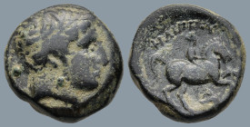 KINGS OF MACEDON. Philip II (359-336 BC). Uncertain Macedonian mint
AE Unit (17,6mm 6,7g))
Obv: Diademed head of Apollo right.
Rev: Youth on horseb...