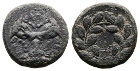 Phokis. Federal Coinage, circa 351 BC and later. AE (Bronze, 21.9 mm, 8.27 g). Phalaikos, strategos. Three heads of bulls facing, fillets hanging from...