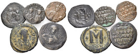 BYZANTINE. Circa 6th-11th century. (Bronze, 56.67 g, 1 h). Lot of five (5) Byzantine bronze coins, varied patination and surfaces, some overstruck, mo...