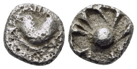 KYRENAIKA. Kyrene. Circa 525-480 BC. Obol (Silver, 7.5 mm, 0.56 g, 12 h). Silphium fruit. Rev. Central pellet with radiating lines within incuse squar...