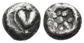 KYRENAIKA. Kyrene. Circa 500-480 BC. Obol (Silver, 6.5 mm, 0.66 g). Silphium fruit with point downwards. Rev. Stellate pattern within incuse square. B...
