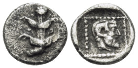 KYRENAIKA. Kyrene. Circa 480-435 BC. Obol (Silver, 9 mm, 0.64 g, 12 h). Silphium plant with five flowers and two pairs of leaves. Rev. Bearded head of...