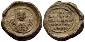 BYZANTINE SEALS. Michael, protostrator, Circa 11th century. Seal or Bulla (Lead, 20,5 mm, 8.00 g, 12 h). Nimbate bust of the Archangel Michael, holdin...