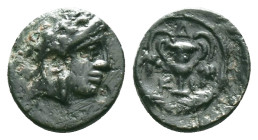 BITHYNIA. Kios. Ae (3rd century BC).Obv: Head of Mithras right, wearing a laureate tiara.Rev: K - I.Kantharos with two grape vines; all within grain w...