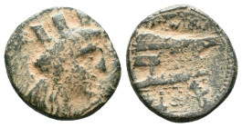 PHOENICIA. Arados. (Circa 242-166 BC).AE Bronze ( )Obv: Turreted head of Tyche right.Rev: Athena standing left on prow of galley left; monogram to upp...