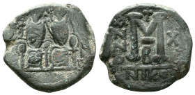 Justin II, 565 – 578Follis, Nicomedia 569-570, Æ. Justin and his wife Sophia, seated facing on throne: the Emperor holds globus cruciger , Sophia a cr...