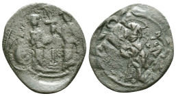 CONSTANTINE X DUCAS with EUDOCIA (1059-1067). Follis. Constantinople. Obv: + ЄMMANOVHΛ / IC - XC. Christ Pantokrator standing facing on footstool. Rev...