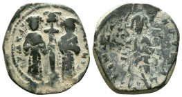 CONSTANTINE X DUCAS with EUDOCIA (1059-1067). Follis. Constantinople. Obv: + ЄMMANOVHΛ / IC - XC. Christ Pantokrator standing facing on footstool. Rev...