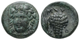 Cyclades, Mykonos. Ae, 5.08 g 17.27 mm. 4th-3rd centuries BC. 
Obv: Head of Dionysos facing slightly to left, wearing wreath of ivy and fruit. 
Rev. M...