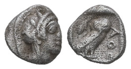 Attica, Athens. AR Hemiobol, 0.30 g 6.72 mm. Circa 454-404 BC.
Obv: Helmeted head of Athena right.
Rev: AΘΕ, Owl standing right, head facing; olive sp...