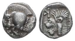 Mysia, Kyzikos. AR Obol, 0.84 g 9.01 mm. Circa 450-400 BC.
Obv.: Forepart of boar left; tunny to right.
Rev.: Head of roaring lion left; retrograde K ...
