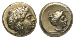 Lesbos, Mytilene. EL Hekte, 2.55 g 10.44 mm. Circa 377-326 BC.
Obv: Head of Dionysos right, wearing ivy wreath
Rev: Head of Persephone right, wearing ...