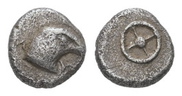 Ionia, Magnesia ad Maeandrum (?).AR Tetartemorion, 0.20 g 5.49 mm. Circa 500-464 BC. 
Obv: M – Y, Head of an eagle to right. 
Rev: Wheel of four spoke...