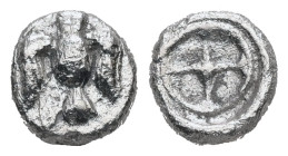 Ionia, Magnesia ad Maeandrum?. AR Hemiobol. 0.35 g. - 6.95 mm. ca. 500-464 BC.
Obv.: Facing eagle with spread wings and legs.
Rev.: Wheel within round...