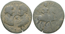Caria, Stratonicaea. Caracalla with Plautilla, AD 198-217. AE. 19.73 g. 35.40 mm. Tiberius Claudius Dionysios, president of the college of the grammat...
