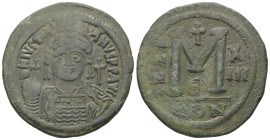 Justinian I, AD 527-565. AE, Follis. 21.59 g. 38.25 mm. Constantinople.
Obv: DNIVSTINI-ANVS PPAVC. Frontal bust of Justinian I wearing helmet with plu...