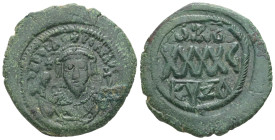 Phocas, AD 602-610. AE, Follis. 11.42 g. 30.60 mm. Cyzicus.
Obv: D N FOCAS PЄRP AVG. Crowned bust facing, wearing consular robes and holding mappa and...