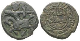 Islamic. Salduqids. Nasir al-Din Muhammad, AD 1168-1191 / AH 563-587. AE, Fals. 8.96 g. 22.47 mm.
Obv: Archer on horseback shooting at gazelle; above,...