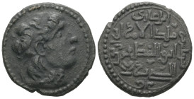 Islamic. Anatolia & al-Jazira (Post-Seljuk). Najm al-Din Alpi, AD 1152-1176 / AH 547-572. AE, Dirham. 15.16 g 30.61 mm.
Obv: Diademed head right withi...