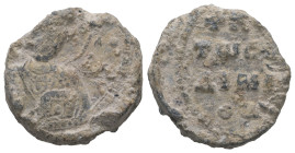 PB Byzantine seal of Nicholas (AD 11th century)
Obv.: Bust of St Nicholas holding the book and offering a blessing. Traces of sigla on either side. Κ...