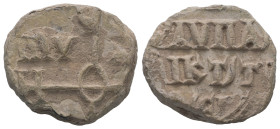 PB Byzantine seal (AD 9th century)
Obv.: A cruciform invocative monogram
Rev.: Inscription of at least four lines.
Weight: 10.56 g.
Diameter: 20.8...