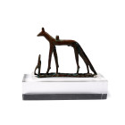 Third Intermediate-Late Period, 1069-332 B.C. Showing the jackal deity Wepwawet standing with ears pricked on a sledge, the slender body modelled with...