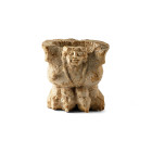5th century B.C. Seated with curving wings flanking the body and stocky body resting on over-sized lion-paws, small female head with rounded facial fe...